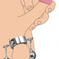 Illustration of the cock ring being worn around the testicles with the additional (separate purchase) weighted balls that can be hung from the side eye-hooks.