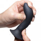 Photo of 2 hands holding the dildo (black) and bending it to the side.