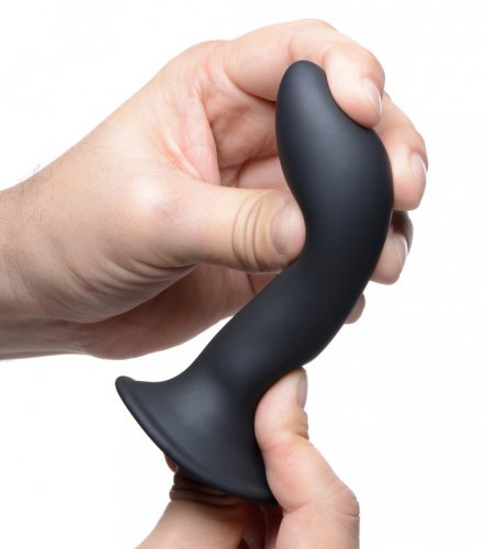 Photo of 2 hands holding the dildo (black) and bending it to the side.