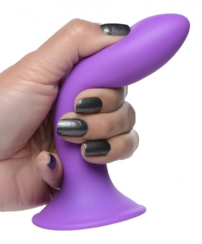 Photo of a hand holding the dildo (purple) and squeezing it while bending it to the side.