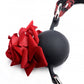Close-up of the ball gag and rose, showing details of the rose petals.