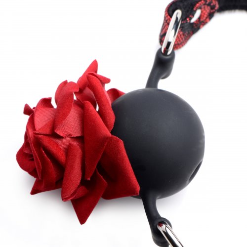 Close-up of the ball gag and rose, showing details of the rose petals.