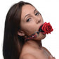 Photo of a woman wearing the rose ball gag.
