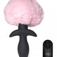 Front facing photo of the pink bunny tail plug and remote control.