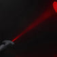 Plug shining the red laser heart image on a black background. 