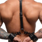 Photo of a man wearing the harness on the backside of his body (wrists cuffed behind his back).