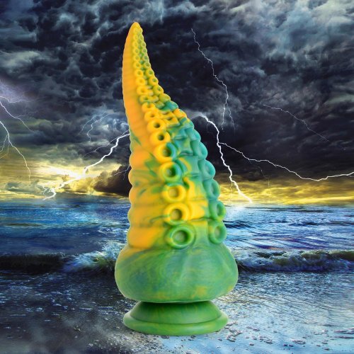 Fantasy image of the Monstropus dildo sitting on a dark beach with the tide water coming up. There are also ominous clouds and lightening in the background.