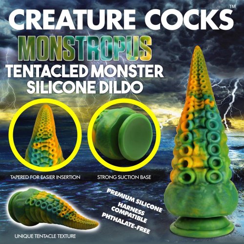 Advertisement for Creature Cocks Monstropus Tentacled Monster Silicone Dildo. Shows various angles of the toy and notes that it is made of premium silicone, harness compatible, and phthalate-free.