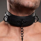 Close-up photo of a man's neck wearing the collar with the chain leash attached.