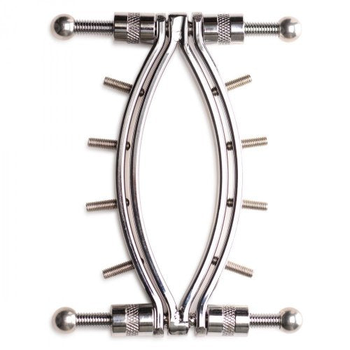 Stainless Steel Labia Clamp lying flat on a surface to show its locking mechanisms (pressure screws).