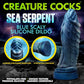 Creature Cocks ad for the Sea Serpent Blue Scaly Silicone Dildo. Picture has a large side view of the toy, as well as two small circular images showing the suction cup and the tip of the dong. It notes that the toy is Phthalate-free, has Unique Texture, Premium Silicone, and is Harness Compatible. 