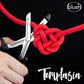 Ad for the Temptasia Safety Scissors cutting through a beautiful red rope Shibari knot.